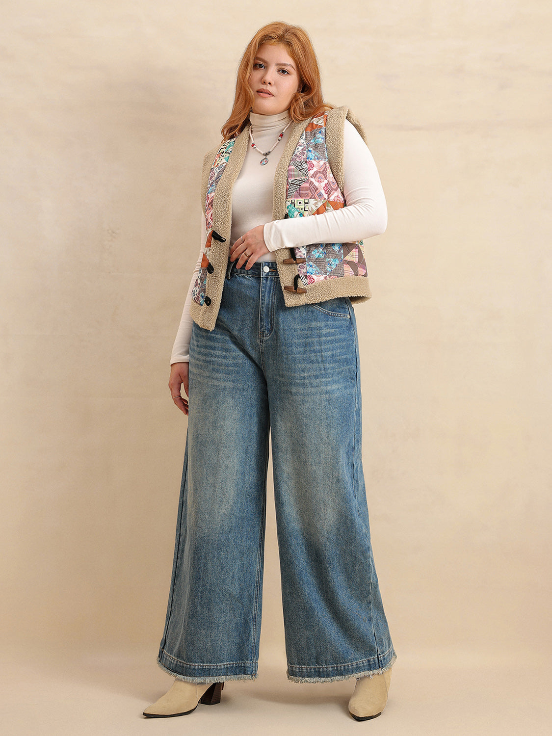 Patchwork sherpa vest with toggle closure and multicolor boho print.