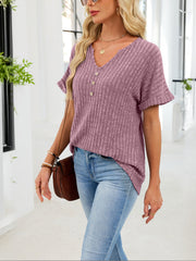 Ribbed knit short sleeve t-shirt in dusty blue with v-neck and decorative buttons.