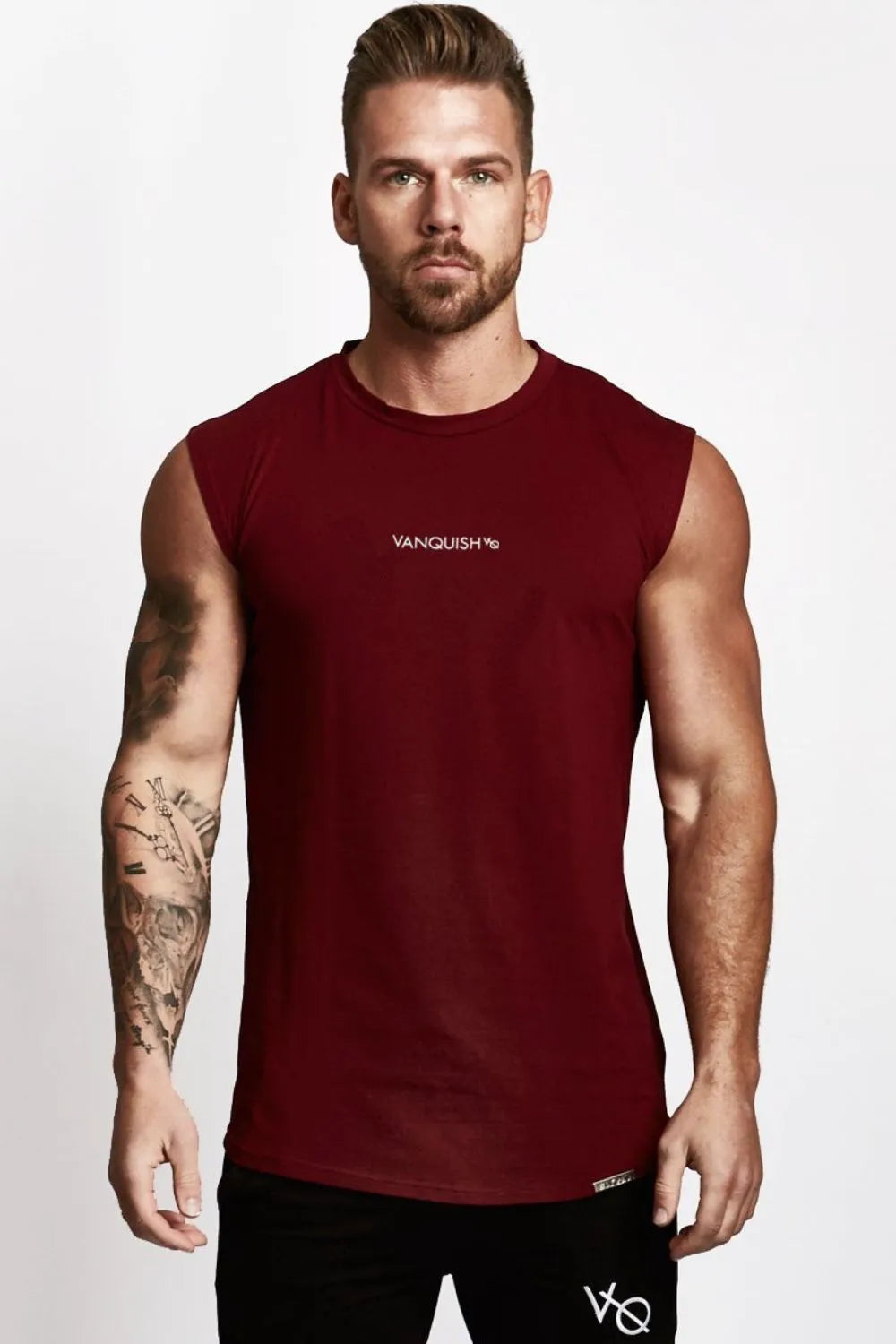 Burgundy performance tank top with white logo detail on chest