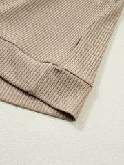 Cozy ribbed knit maternity shirt in tan with denim accents, close-up of cuff detail.