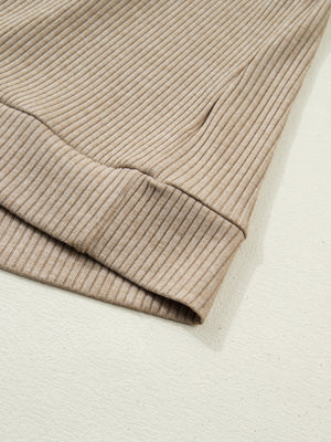 Cozy ribbed knit maternity shirt in tan with denim accents, close-up of cuff detail.