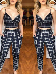 Chic black and white grid print two-piece set with a cropped cami and belted pants.