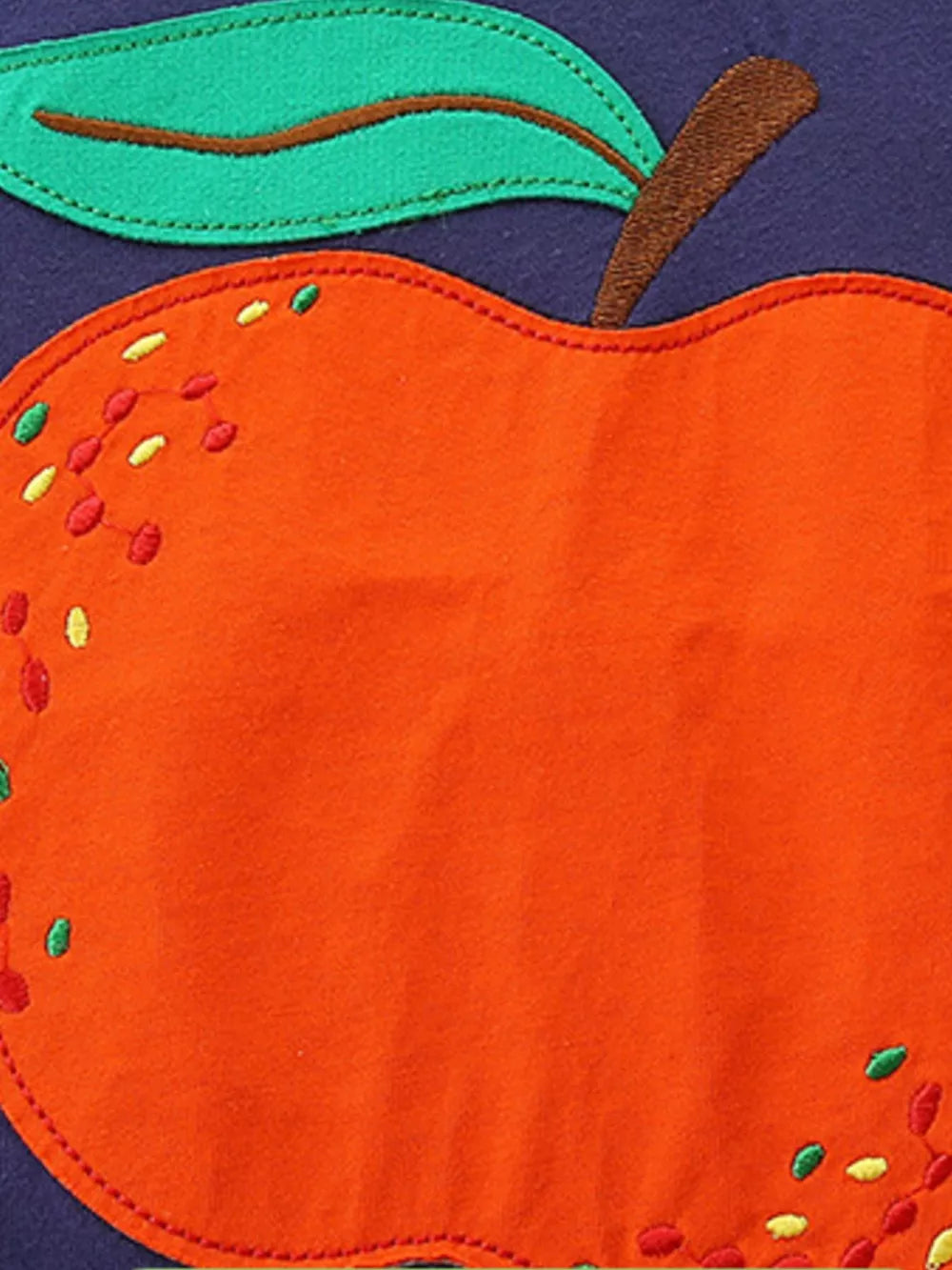 Toddler t-shirt with bright orange apple appliqué and green leaf detail.