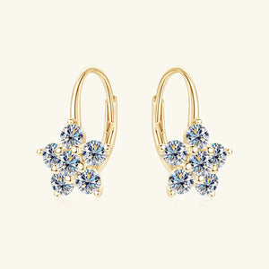 Gold celestial cluster huggie hoop earrings with clear cubic zirconia stones.