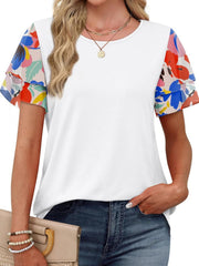 White t-shirt with layered ruffled short sleeves featuring a multicolor floral print.