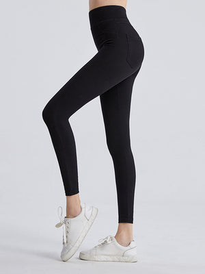 Black activewear leggings with a high waist and pocket detail.