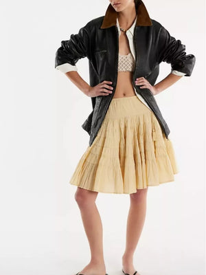 Tiered drawstring mini skirt in Pastel Yellow with ruffled tiers.