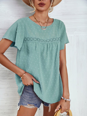 Light green Swiss dot blouse with flutter sleeves and eyelet detail.