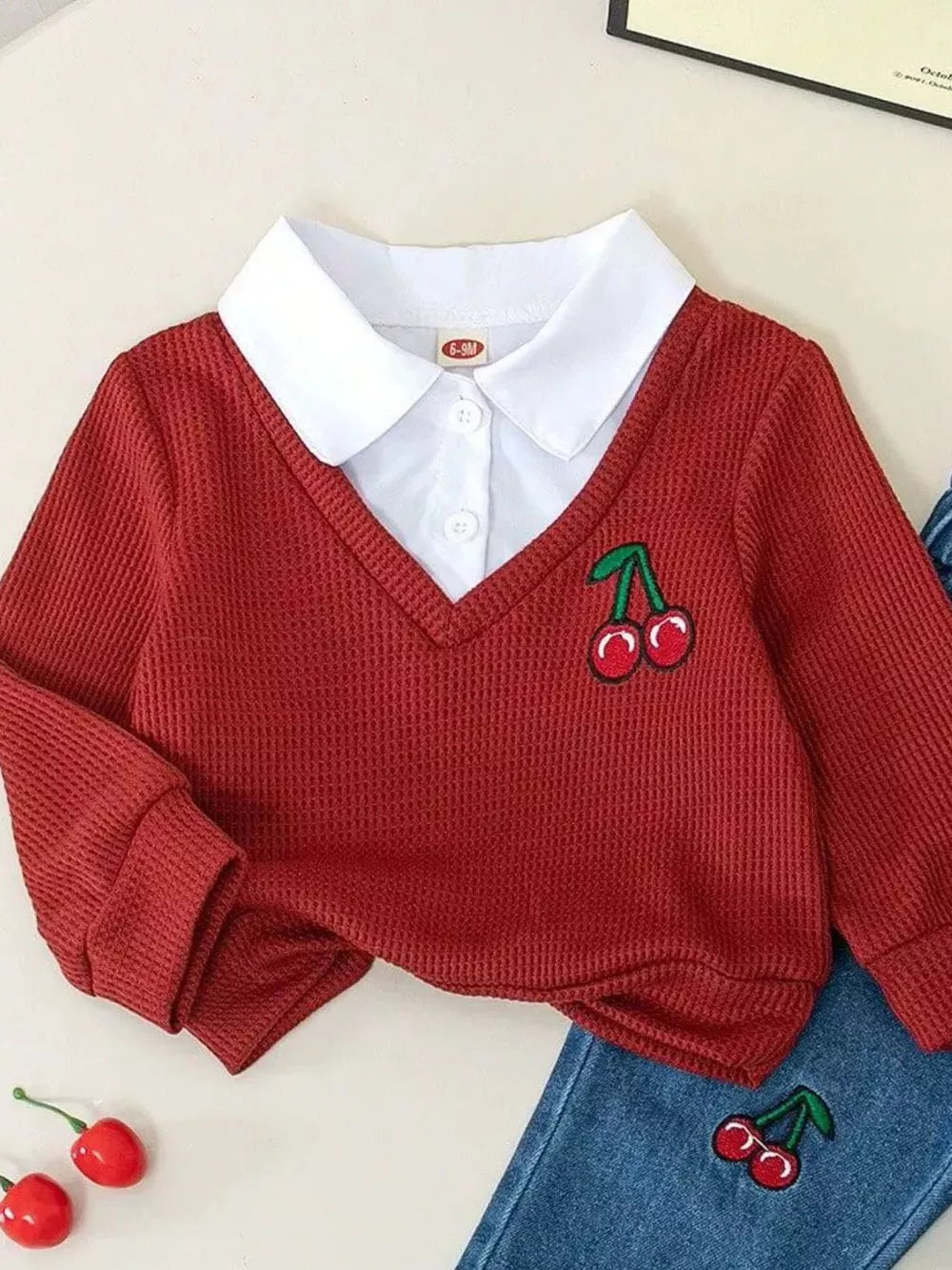 Deep Red baby set with white collar shirt and cherry embroidery detail.
