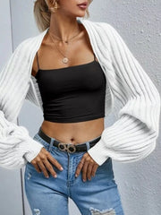 White balloon sleeve cropped knit cardigan with ribbed texture and open front.
