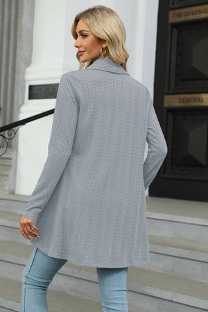 Drape-front cable knit cardigan in Cloudy Blue with long sleeves and a relaxed fit.