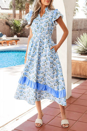 Midi dress with hydrangea print, flutter sleeves, smocked waist, and tiered ruffle hem.