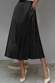 Black a-line midi skirt with hidden pockets in lustrous fabric