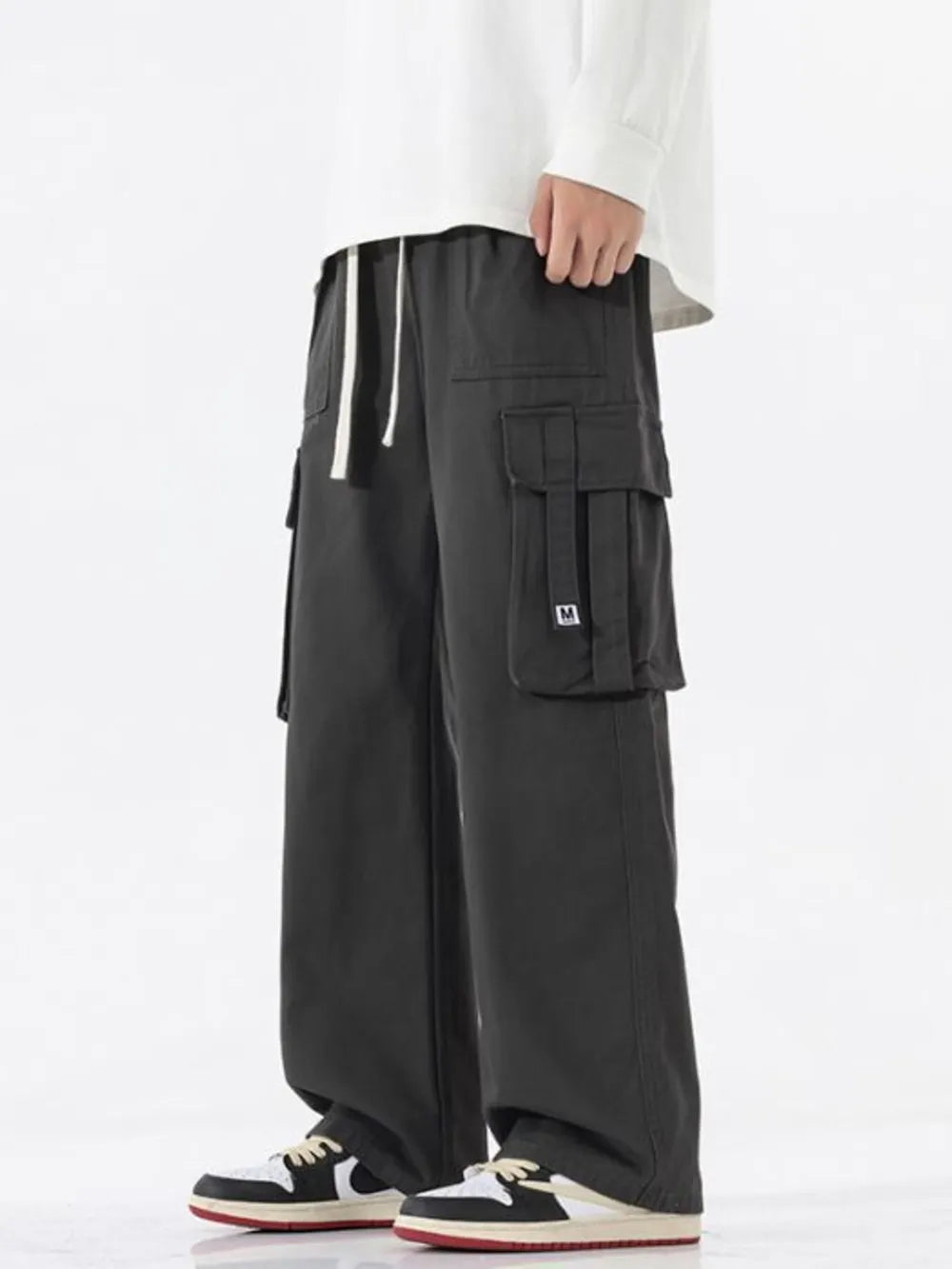 Dark Gray wide-leg cargo sweatpants with drawstring waist and multiple pockets.