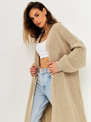 Oversized tan ribbed knit maxi cardigan with balloon sleeves and an open front.