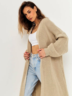 Oversized tan ribbed knit maxi cardigan with balloon sleeves and an open front.