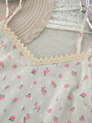 Floral cami with lace trim and delicate pink floral print.