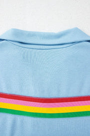 Light blue activewear shorts with rainbow stripe detail and collar