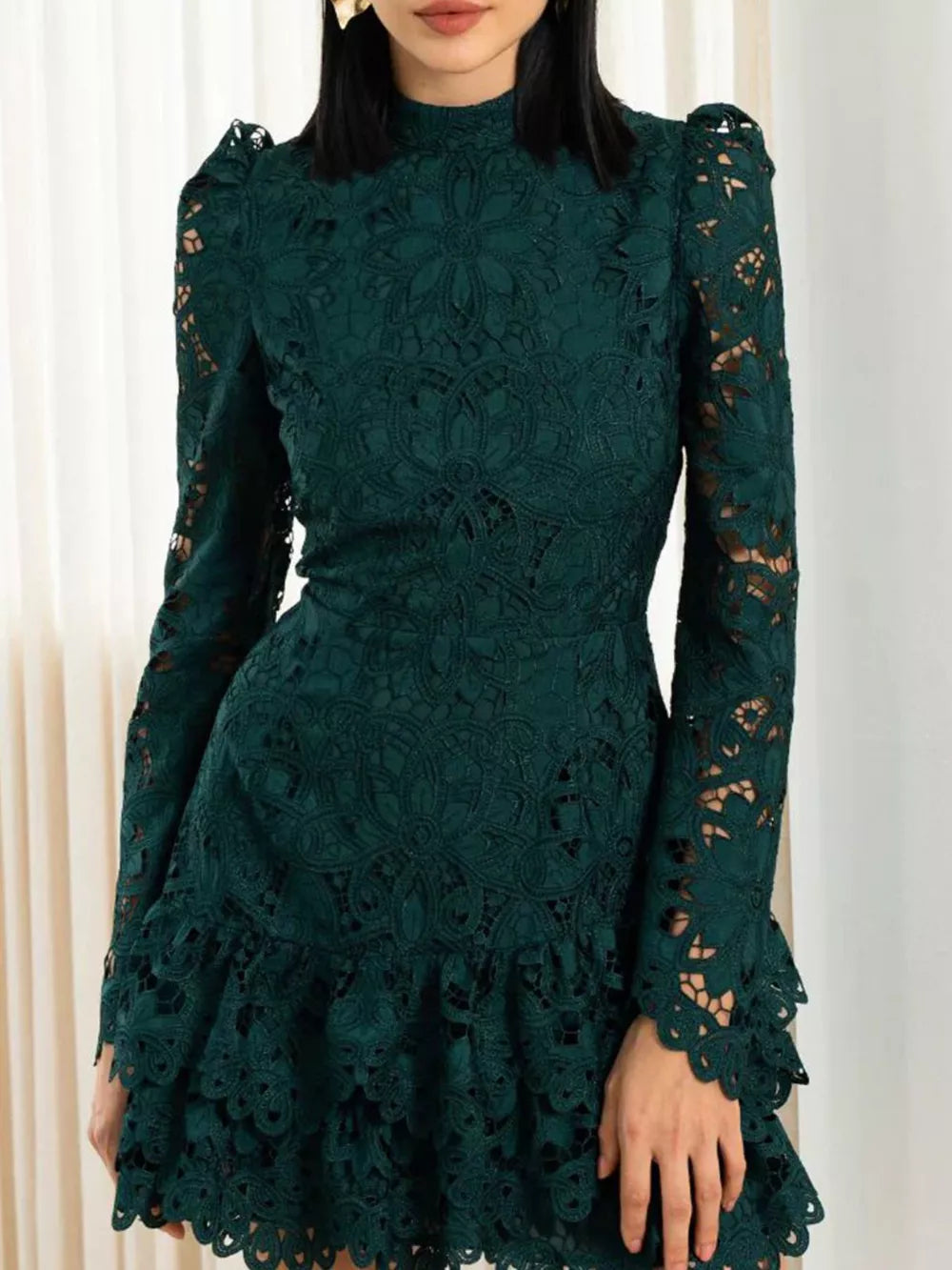 Dark green floral lace mock neck mini dress with ruffled hem and bell sleeves.