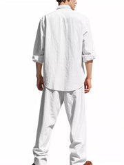Men's white linen blend casual two-piece set with rolled sleeves and wide-leg pants.