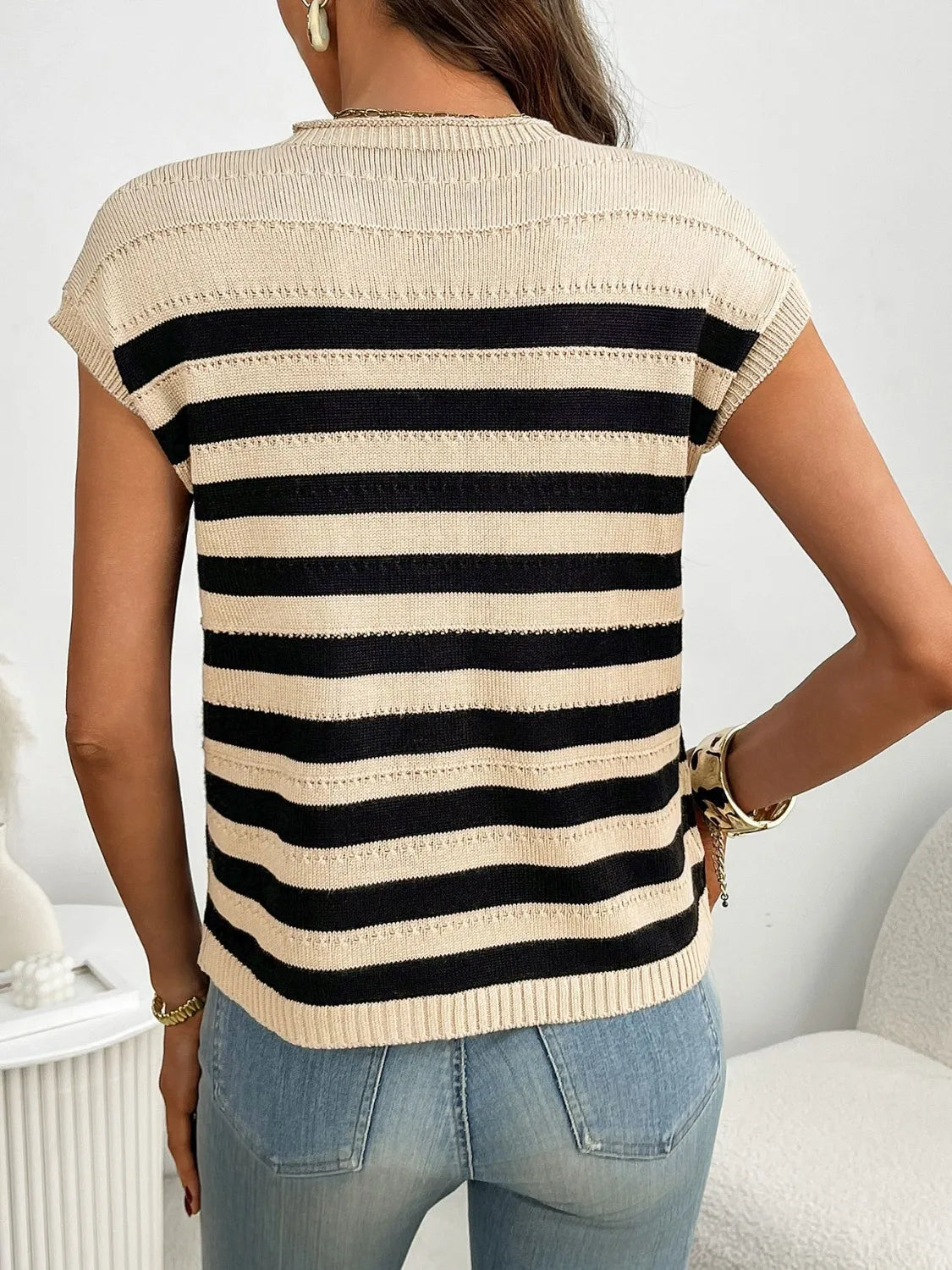 Striped knit t-shirt in beige and black with short sleeves and a crew neck.