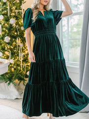 Dark green velvet maxi dress with tiered skirt and smocked waist.