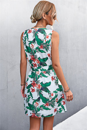 White floral mini dress with green leaves and red flowers, sleeveless with tie waist