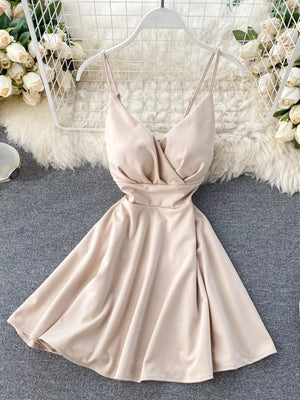 Apricot V-neck spaghetti strap mini dress with adjustable straps and a flared skirt.