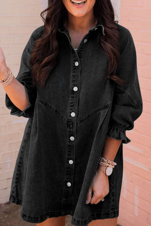 Black denim shirtdress with button front and ruffled cuffs.