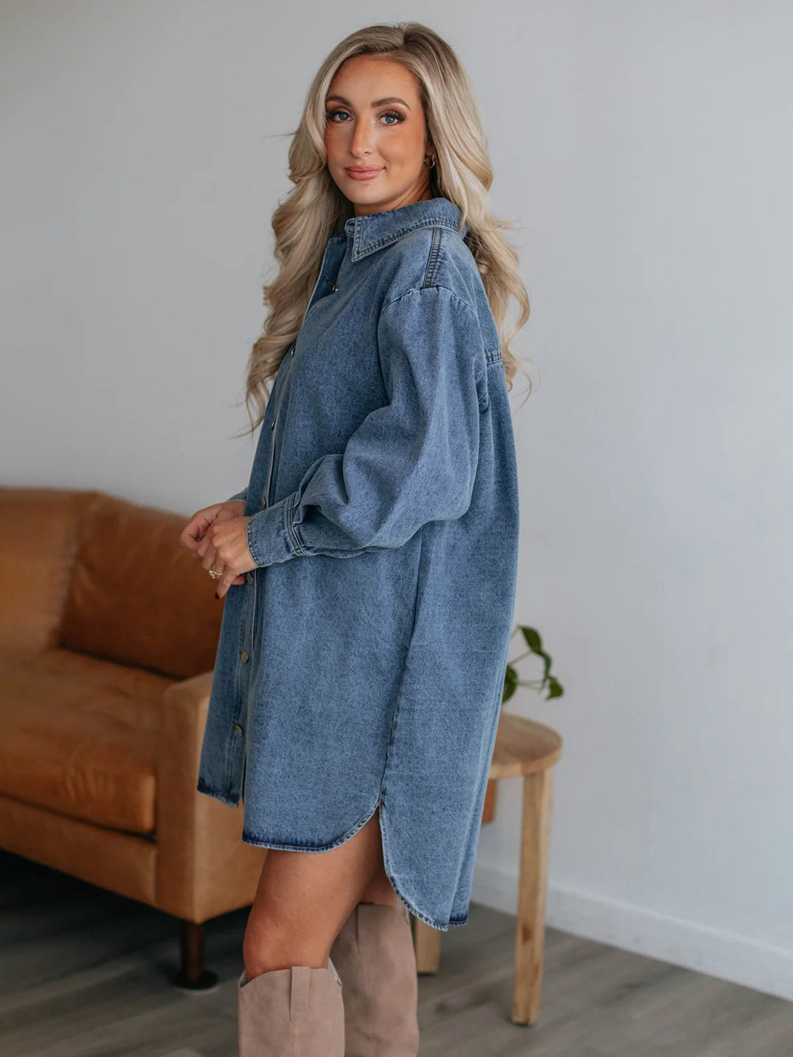 Oversized denim shirtdress in medium wash with button front and side slits.
