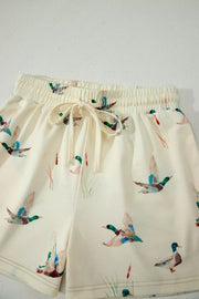 Beige pajama shorts with mallard duck print and drawstring waist.
