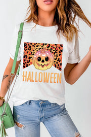 White t-shirt with a Halloween pumpkin graphic and leopard print detail.