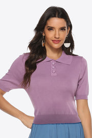 Lilac button-down knit polo top with short sleeves and a ribbed hem.