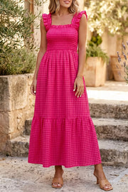 Charming plaid fit-and-flare sundress in deep rose cotton with smocked bodice and ruffled square neckline.