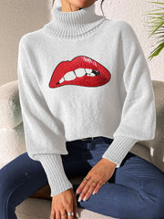 White turtleneck sweater with sequin red lips detail and balloon sleeves.