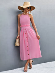 Pink button-down midi dress with halter neck and ruffled waist detail.