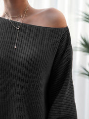 Black off-shoulder ribbed knit mini dress with a relaxed fit.