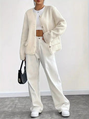 Ivory textured button-up fleece jacket with round neckline and silver buttons.