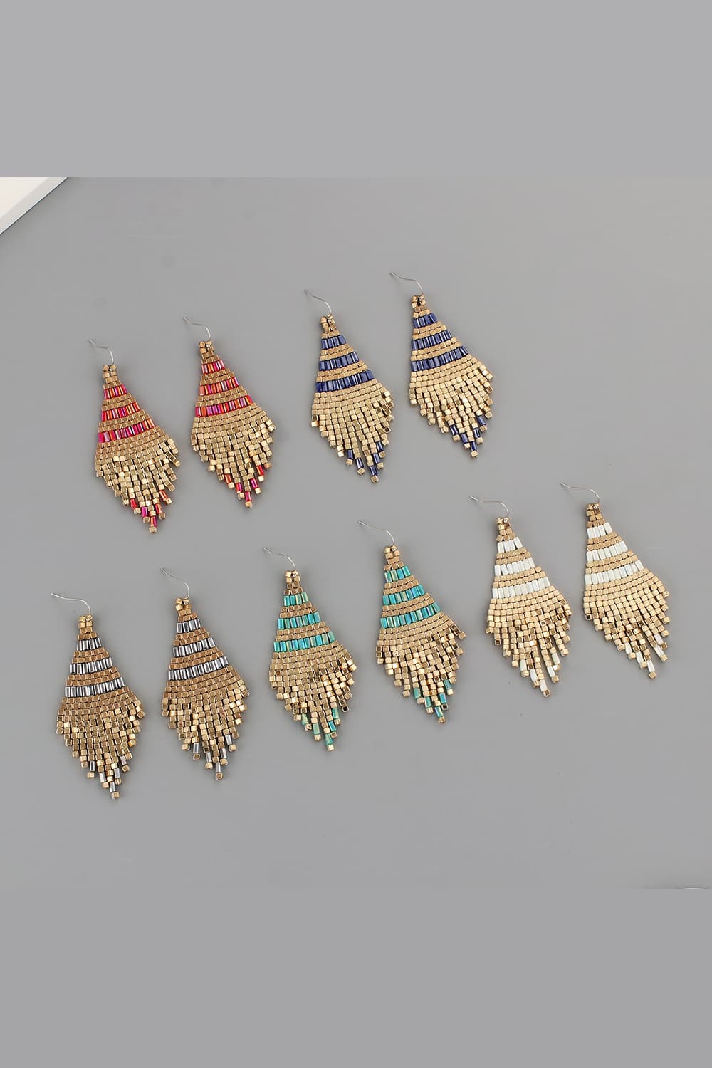 Geometric beaded fringe earrings with gold accents and red, blue, turquoise, or white beads.