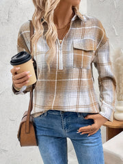 Plaid zip-through utility blouse in camel with a chest pocket and collared neckline.