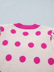 Cream knit top with hot pink polka dots and a pink neckline.
