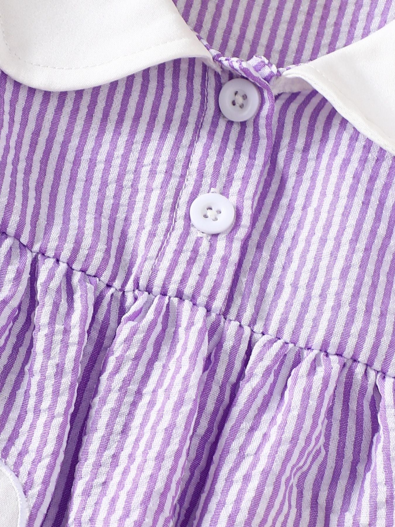 Children's purple and white striped cotton top with white collar and buttons.