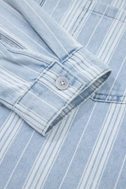 Denim shacket with white vertical stripes, button cuff detail, and chest pocket.