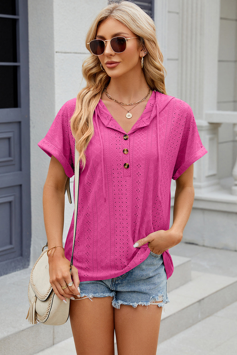 Hot Pink perforated henley hooded tee with short sleeves and button detail