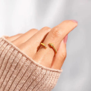 Gold snake ring with diamond accents, 18K gold-plated bypass design.