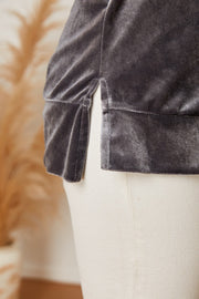 Velvet top in dark gray with side slits and a banded hem.