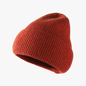 Ribbed knit slouch beanie in Rust with a relaxed fit.
