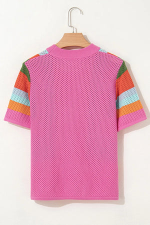 Pink openwork knit t-shirt with multicolor geometric stripe sleeves.