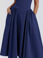 Dark Blue midi dress with spaghetti straps, sweetheart neckline, and pockets.