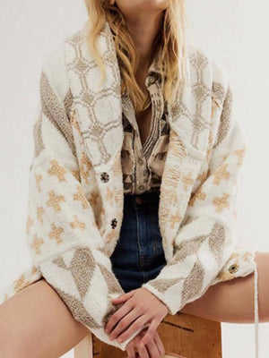 Geometric patchwork knit cardigan with button front and shawl collar in cream and tan.